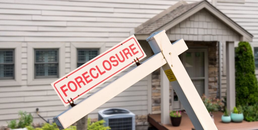 More Deals, Lower Pricing—A Look at What’s Going On at Foreclosure Auctions in Late 2025 foreclosure sign in front of house